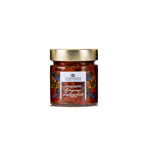 Glazen pot met gouden deksel, gevuld met donkerrode gedroogde tomaatjes in olie. Etiket met kleurrijke getekende blaadjes en de tekst Pomodoro Ciliegino.